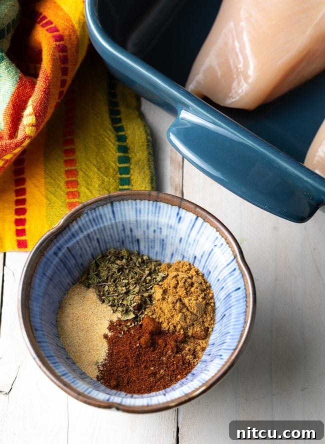 Homemade Chipotle Meal Prep Bowls 5 A small bowl filled with the vibrant chipotle seasoning mix.