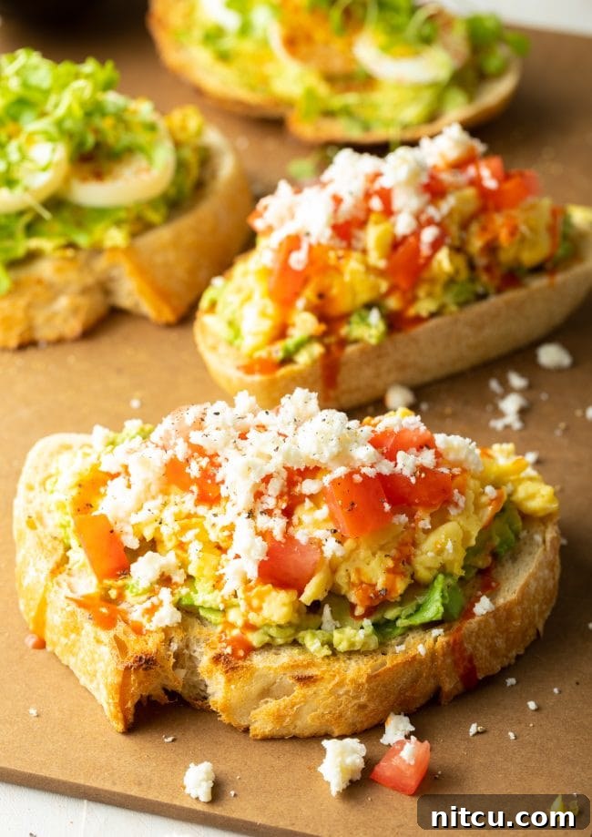 Gourmet avocado toast with a fried egg and fresh microgreens