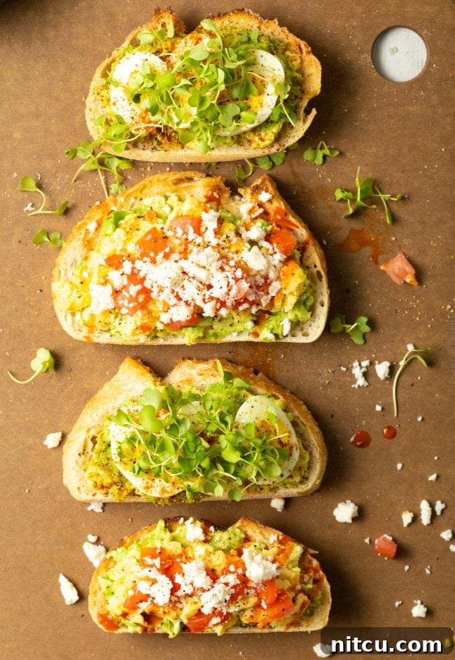 Assortment of avocado toast with egg and various toppings