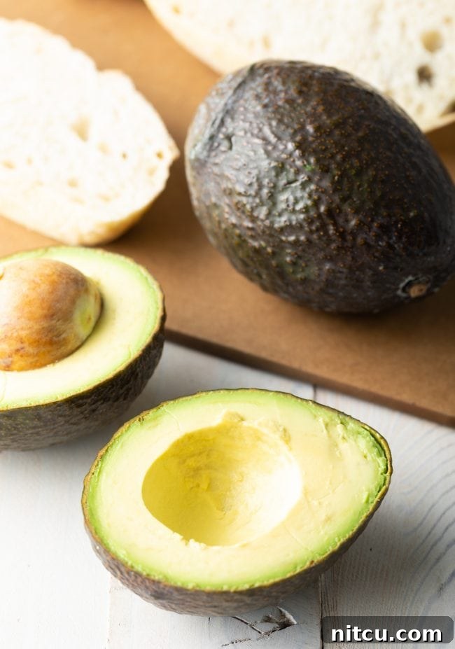 Step-by-step image of cutting and pitting an avocado