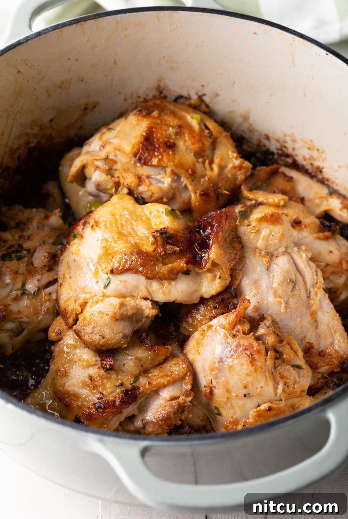 Authentic Jamaican Brown Stew Chicken 6 Browned chicken in a pot.