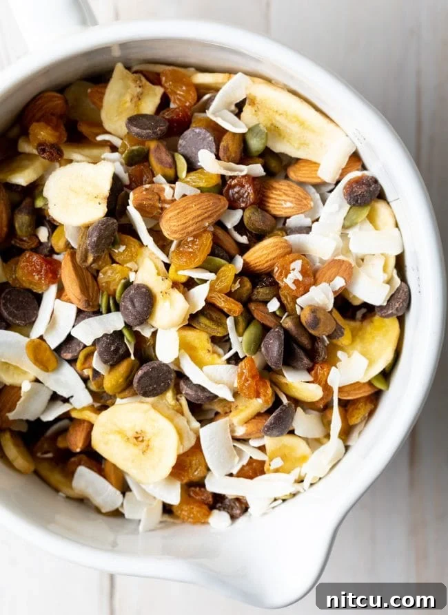 Wholesome DIY Trail Mix 2 Healthy homemade trail mix with seeds and nuts in a white bowl, perfect for a balanced snack.