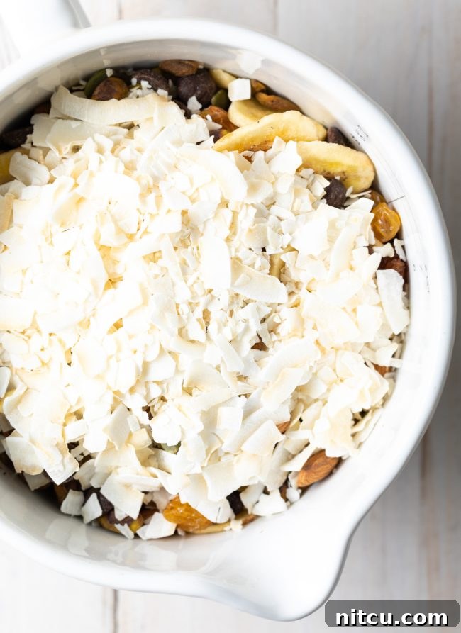 Wholesome DIY Trail Mix 5 Healthy trail mix in a white bowl, ready for snacking.
