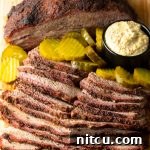 Ultimate Dry-Brined Smoked Brisket 17 Smoked beef brisket with mustard and pickles