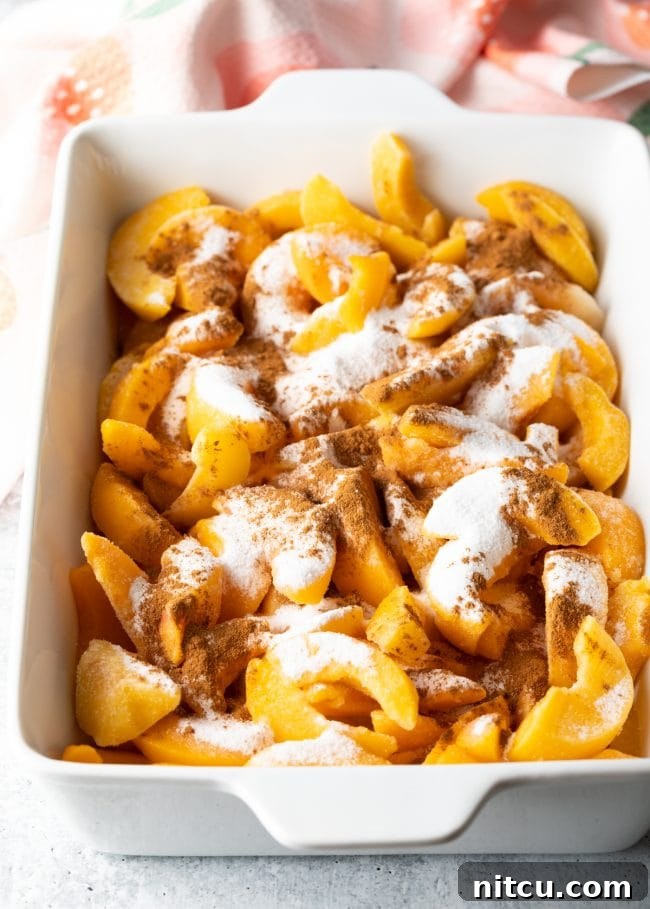 Easy Bisquick Peach Cobbler 5 sliced peach covered with sugar and spices