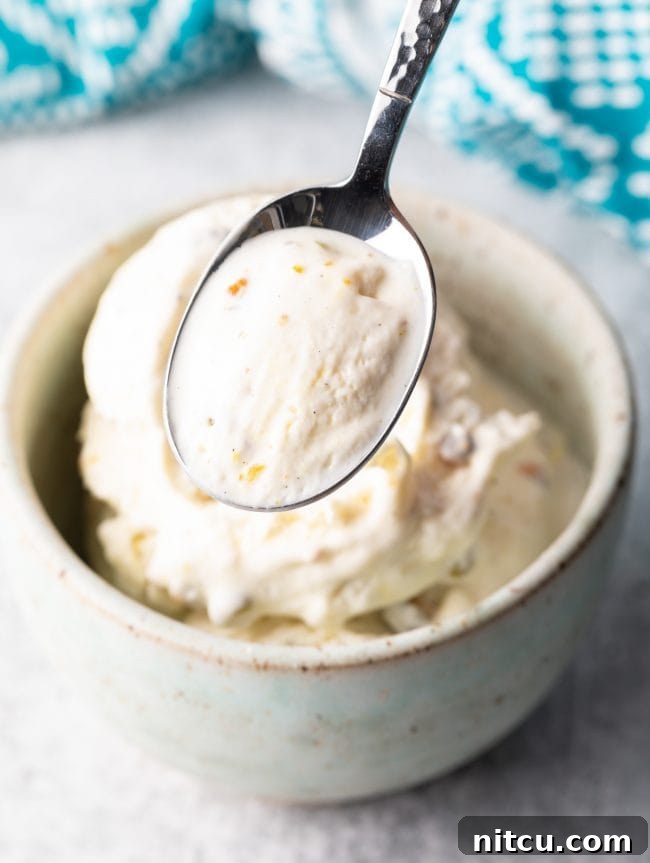 scoop of kulfi saffron ice cream from a bowl