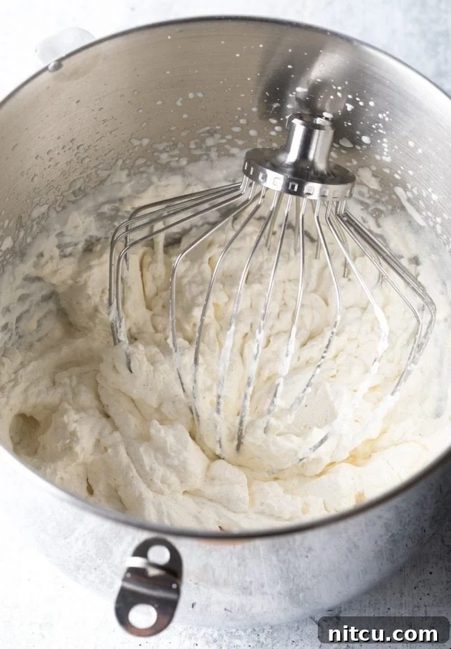whipped cream with a large wire whisk in a standing mixer