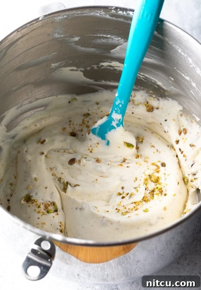 folding in chopped pistachios