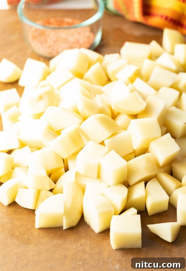 Fiesta Potatoes 6 Peeled and uniformly chopped russet potatoes, ready for frying