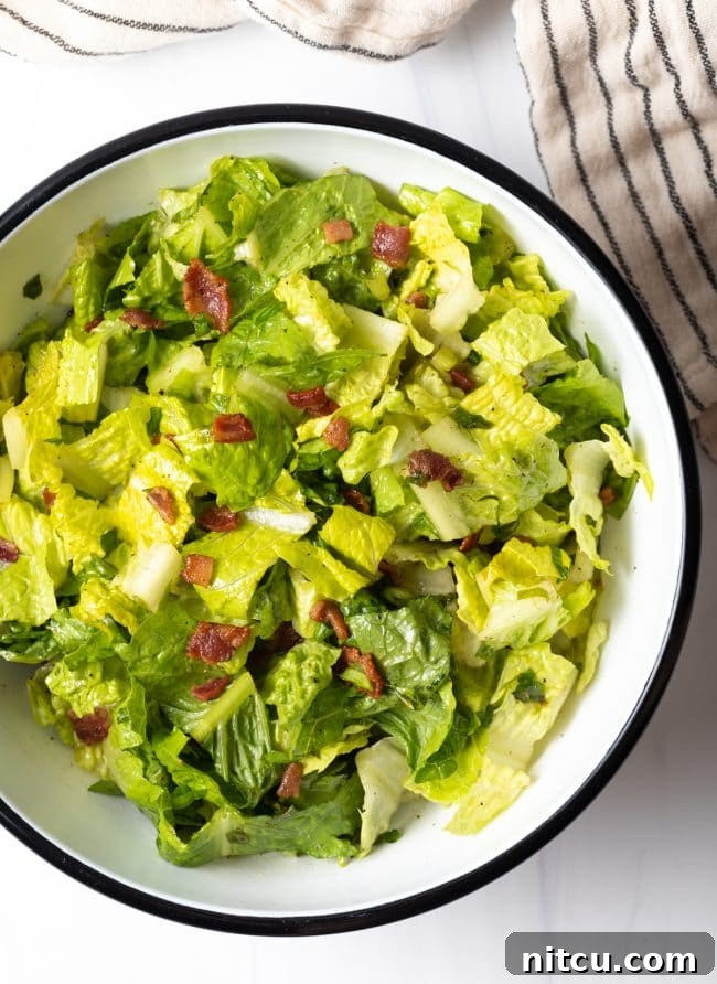 Sad Greens 9 top view salad bowl with chopped romaine lettuce and warm bacon dressing