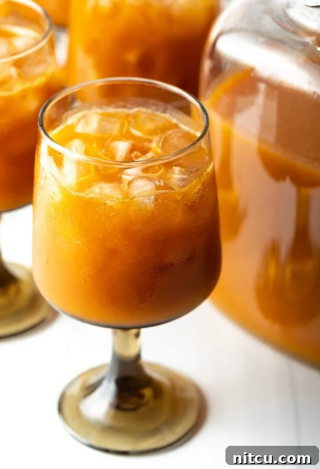 Hogwarts Pumpkin Juice 2 glass of refreshing chilled harry potter pumpkin juice in a glass with ice