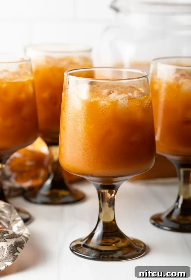 Hogwarts Pumpkin Juice 9 side view of goblets with iced orange pumpkin juice