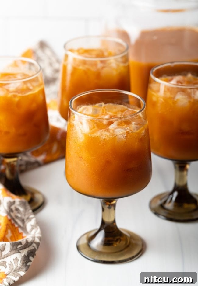 Hogwarts Pumpkin Juice 10 cluster of goblets filled with ice and harry potter copycat pumpkin juice