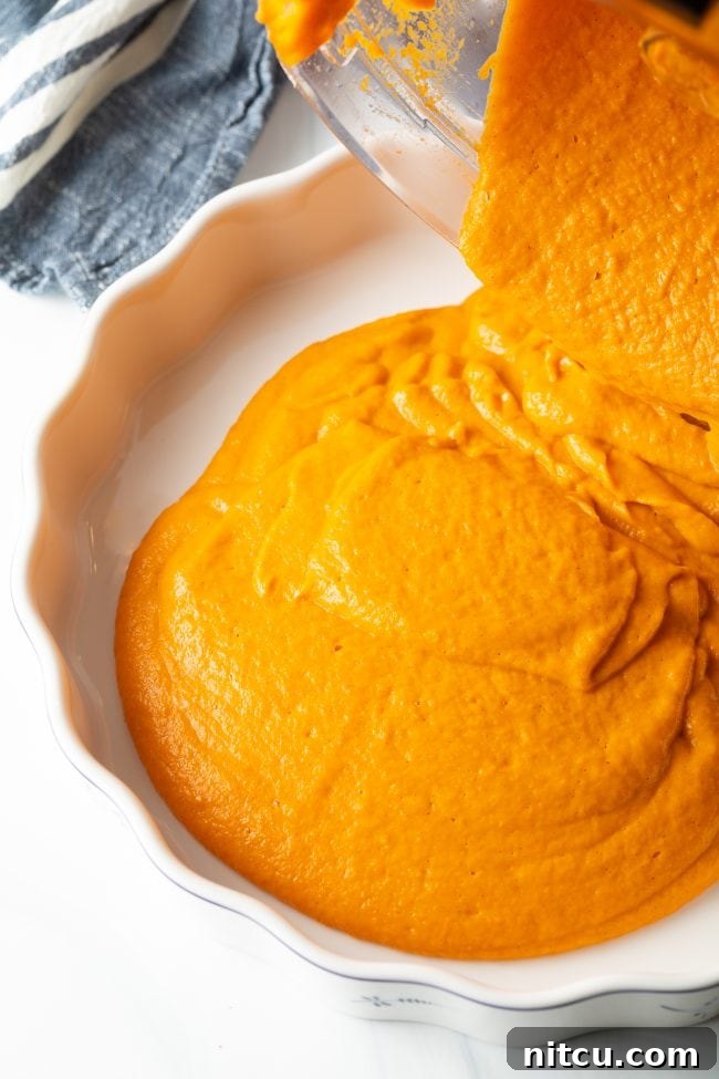 pouring the carrot mixture into a pan