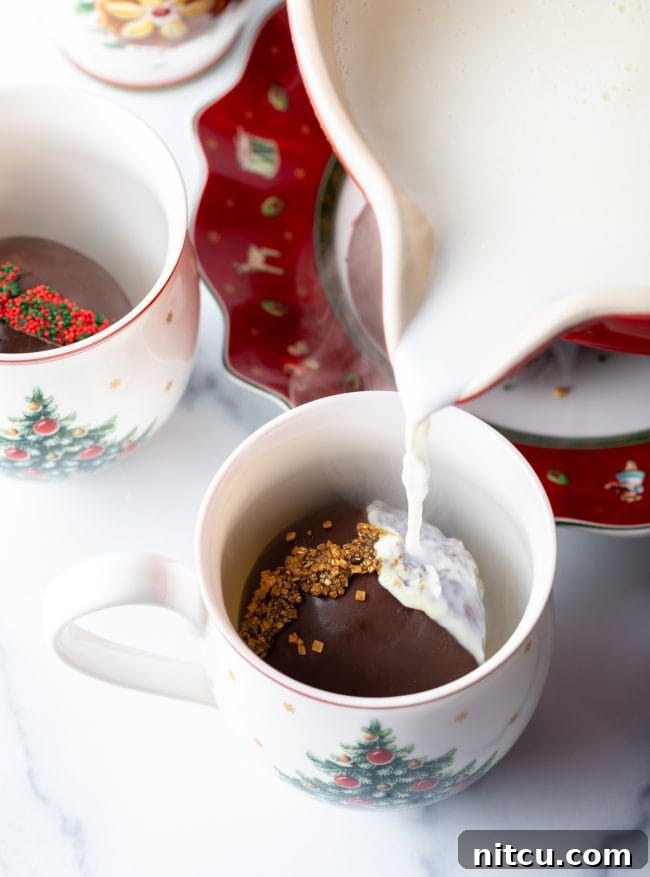Magical Melting Cocoa 12 Hot milk being poured over hot chocolate bomb.