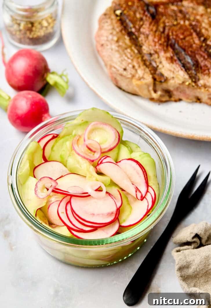 Small glass container of pickled veggies.