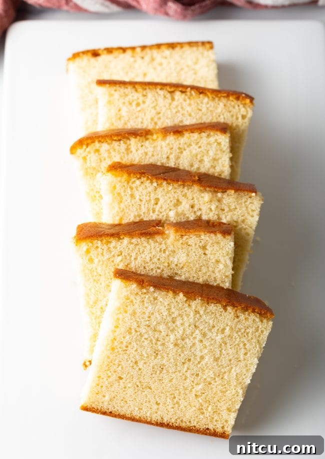 Featherlight Japanese Sponge Cake 12 Slices of Japanese Sponge Cake lined up on a white plate.