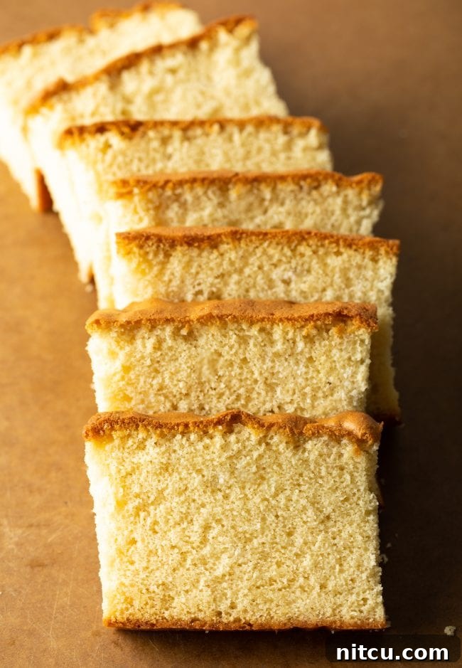 Featherlight Japanese Sponge Cake 3 top down view of slices of castella cake on a brown cutting board
