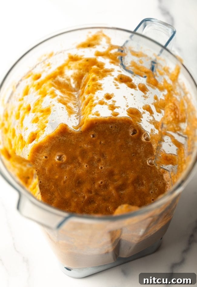 Mexican Fideo Noodle Bowl 8 top view of a blender jar with a smooth, vibrant tomato, garlic, jalapeño, and cilantro puree