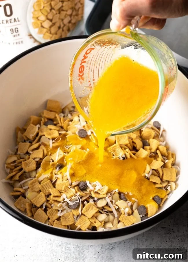Adding whisked egg and sweetener mixture to the dry ingredients in the bowl.
