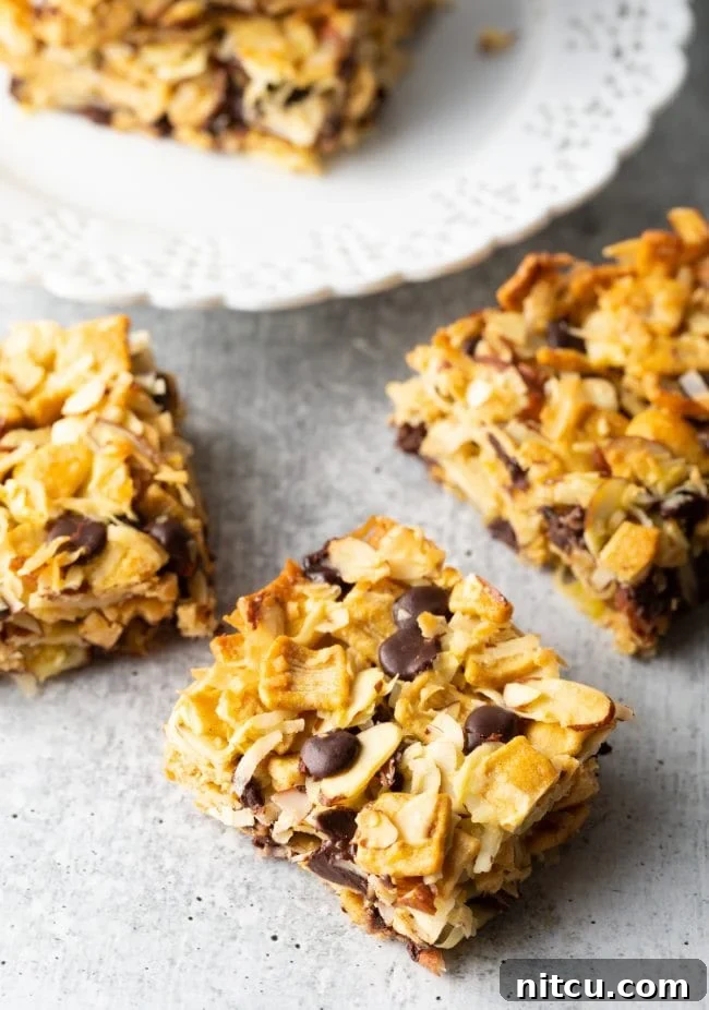 Top view of keto cereal snack bars neatly cut into squares on a cutting board.