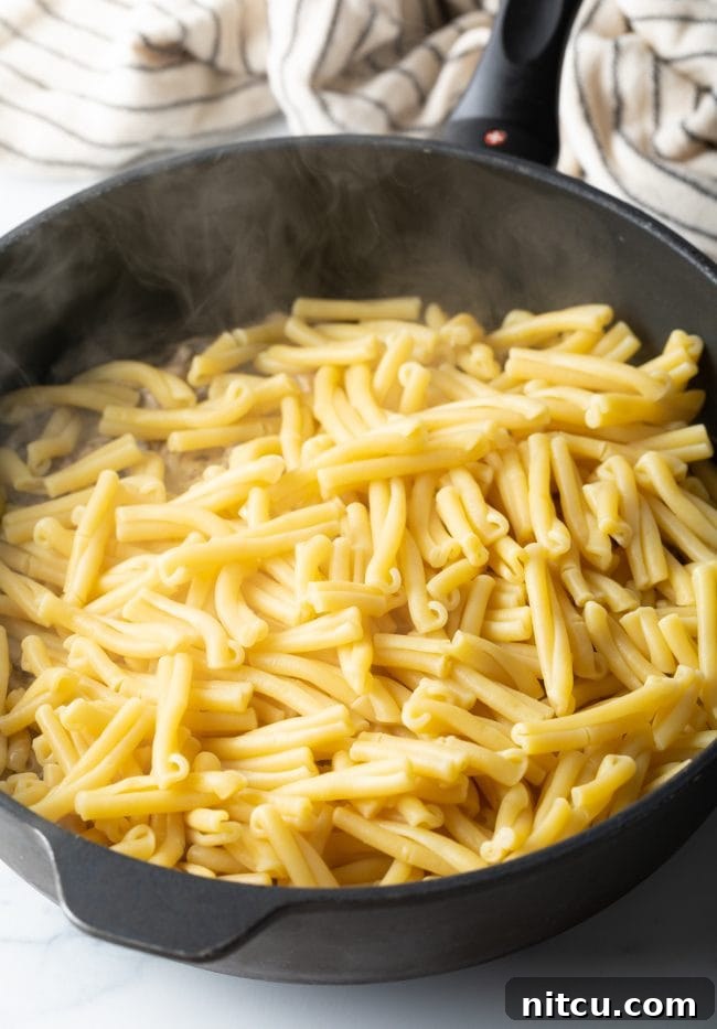 boiled and drained gemelli in a skillet