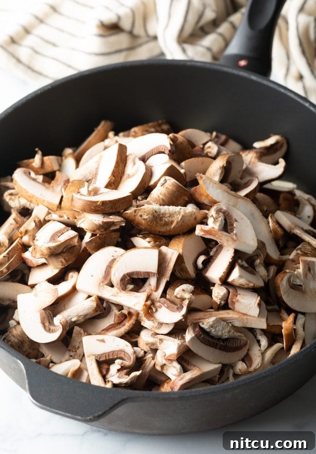 sliced mushrooms in a deep skillet
