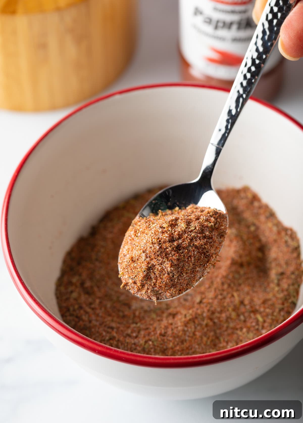Cajun Fries: Homemade Seasoning Blend Recipe 3 Spoon holding bit of spice blend towards camera.