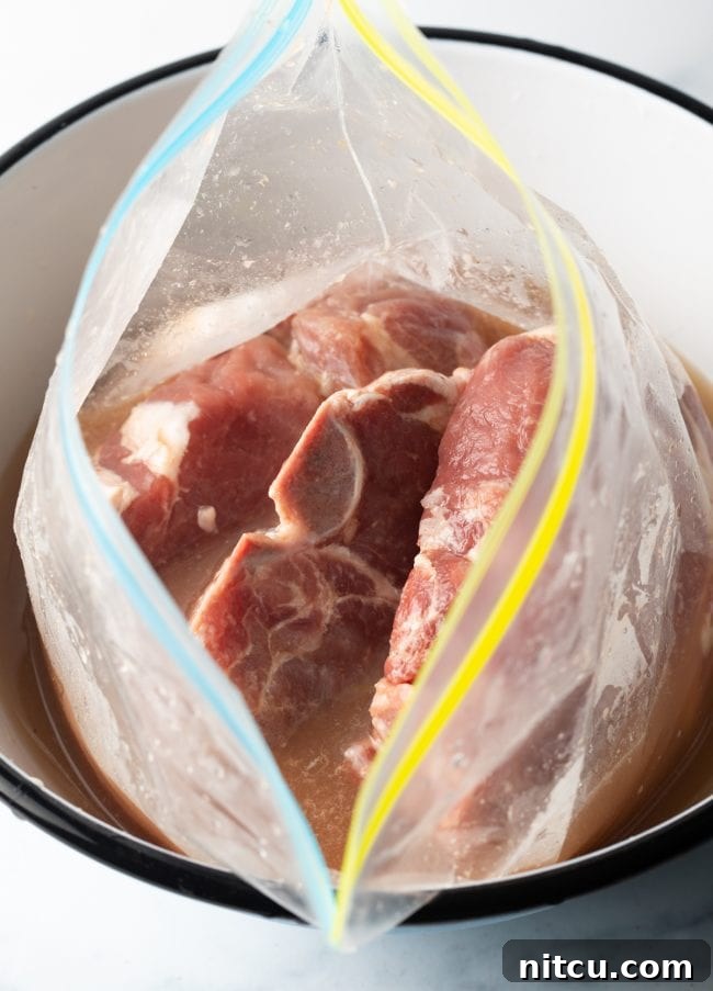 Bone-in meat in a plastic zipper bag with brine.