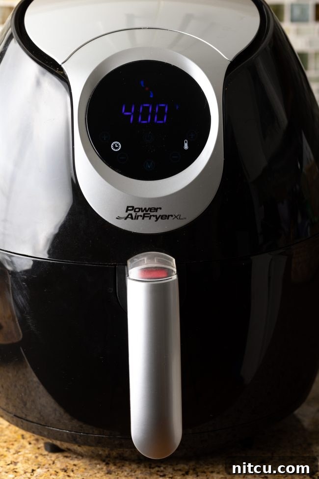 An air fryer display showing a temperature setting of 400 degrees Fahrenheit, indicating it's ready for cooking.
