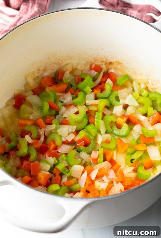 Soulful Cajun Dirty Rice 7 Sauteed 'holy trinity' vegetables in a pot.