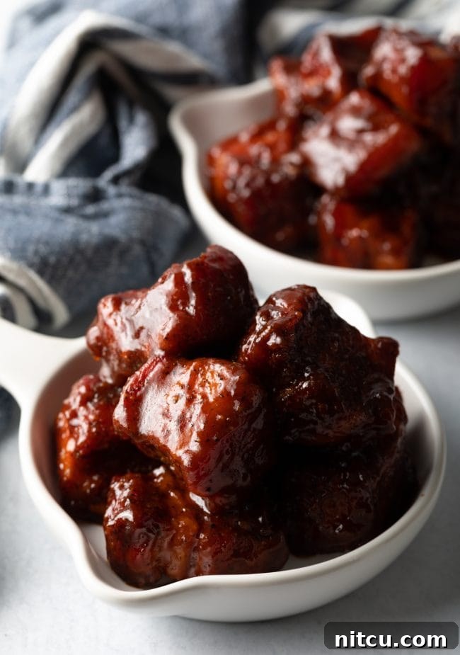 BBQ Pork Belly Candy Bites 2 Deliciously smoked pork belly burnt ends, ready to be enjoyed.