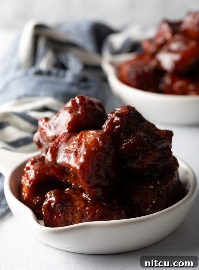 BBQ Pork Belly Candy Bites 11 Smoked Pork Belly Burnt Ends - Tender, flavorful, meaty and utterly mouthwatering BBQ pork belly burnt ends are an absolute dream. They're tossed with a classic brown sugar spice rub, slow smoked, and tossed with tangy barbecue sauce. Then serve warm with your favorite southern side dishes, like macaroni or potato salad. This easy recipe can be made in a smoker or oven! | A Spicy Perspective