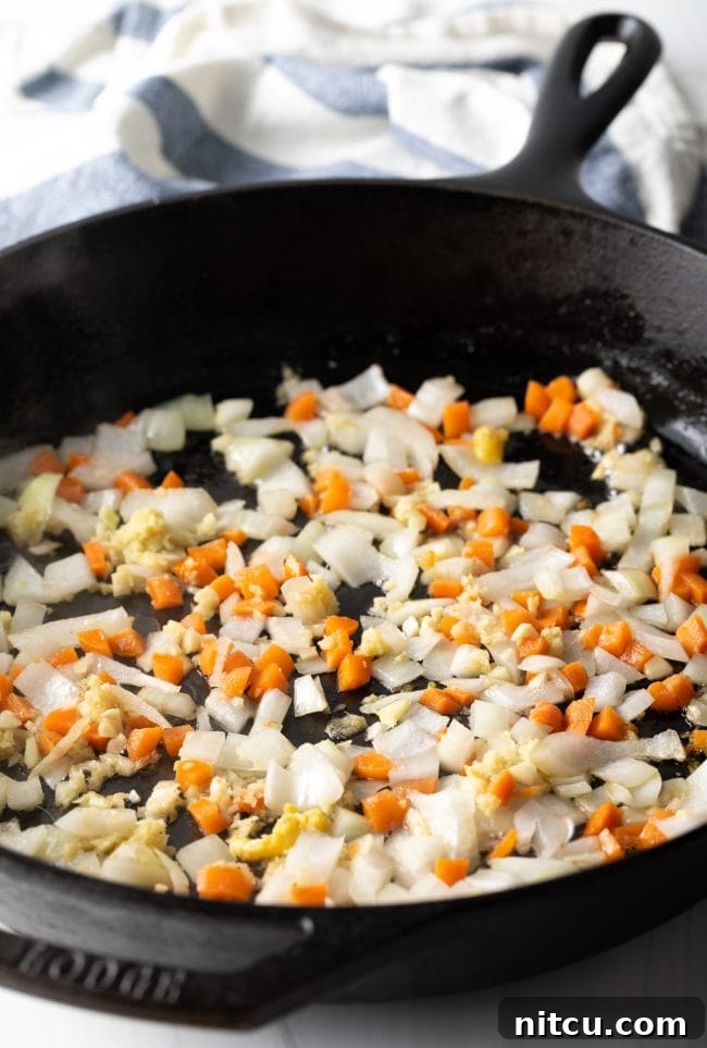 Perfect Homemade Hibachi Rice 8 Fresh vegetables being sautéed in a hot pan, vibrant and fragrant.