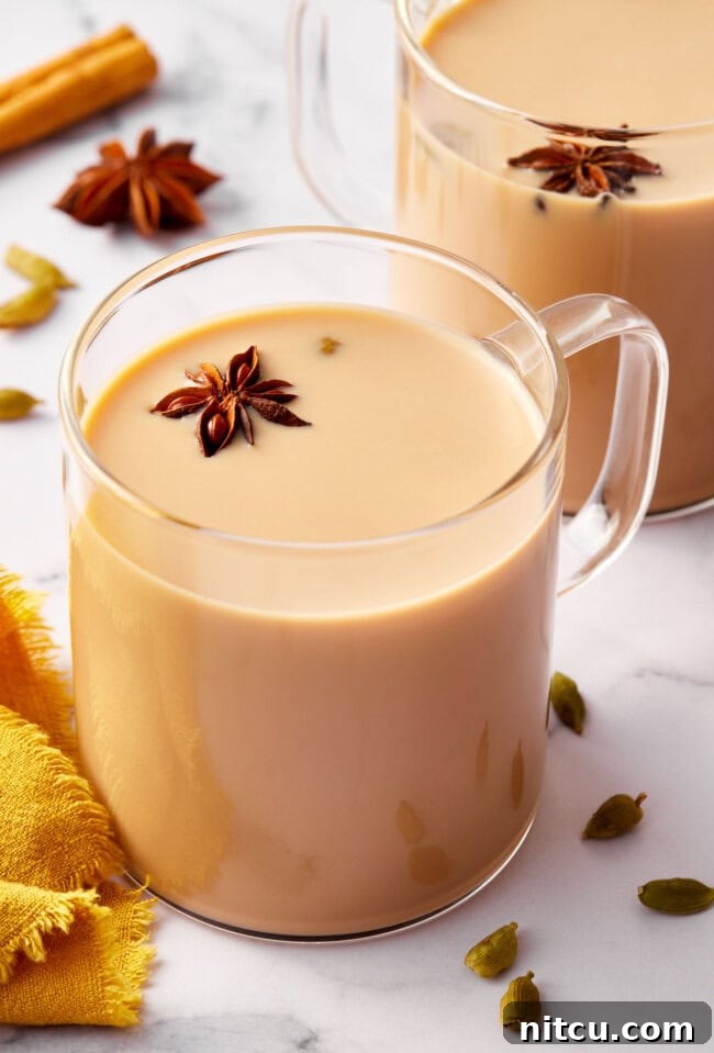 Finest Chai Tea Blends 2 Graphic with text 'How to make Indian chai tea' featuring a photo of hot chai latte in a clear mug, garnished with spices.