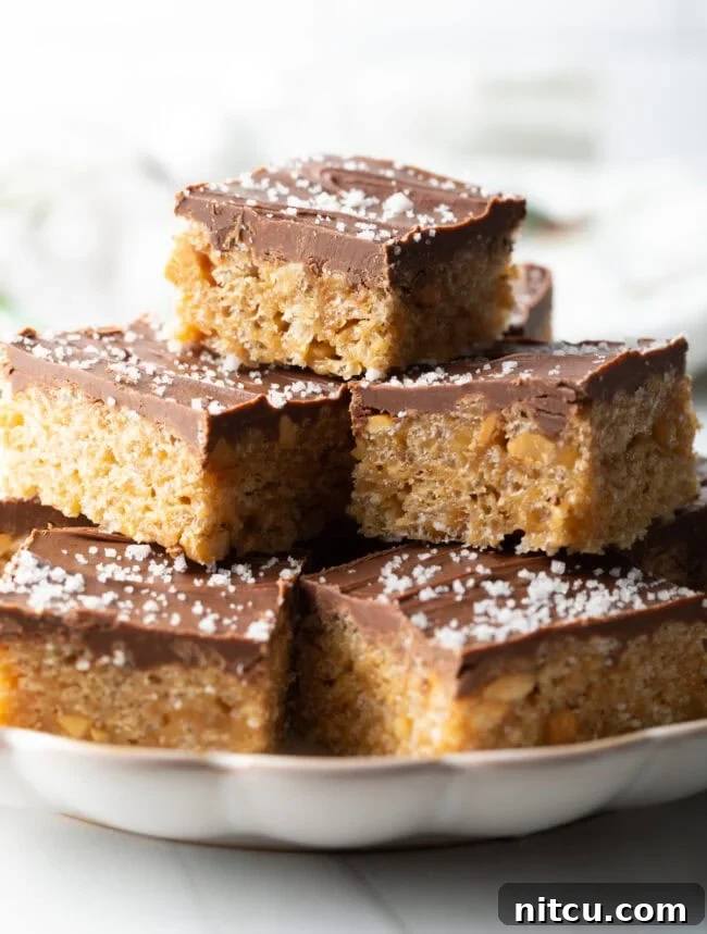 Peanut Butter Rice Krispie Treats 2 Plate of stacked Scotcharoos Peanut Butter Rice Krispie Bars