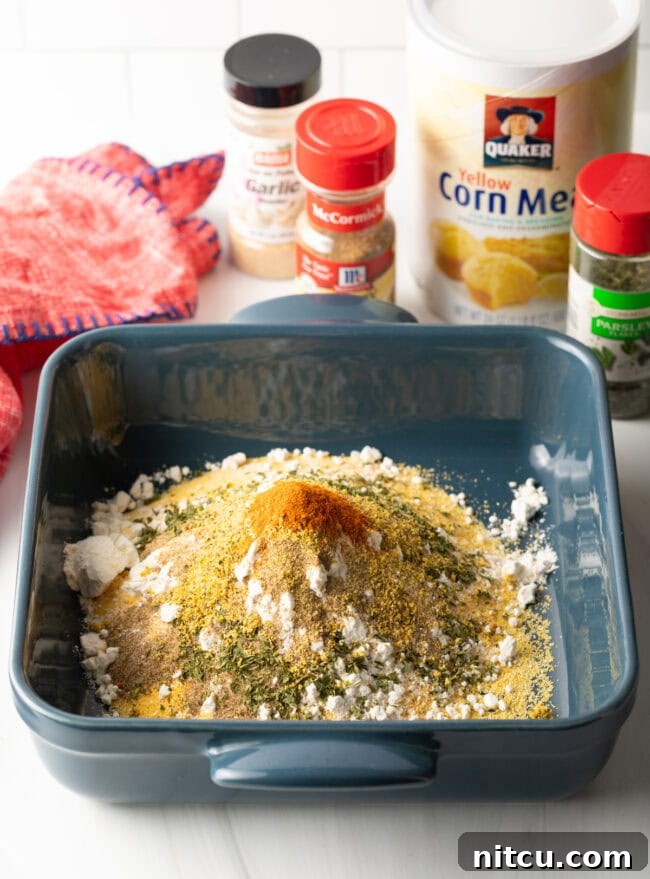 Crispy Corn-Crusted Fish 6 A mix of dry spices, including dried parsley and red pepper flakes, ready to be combined with cornmeal.