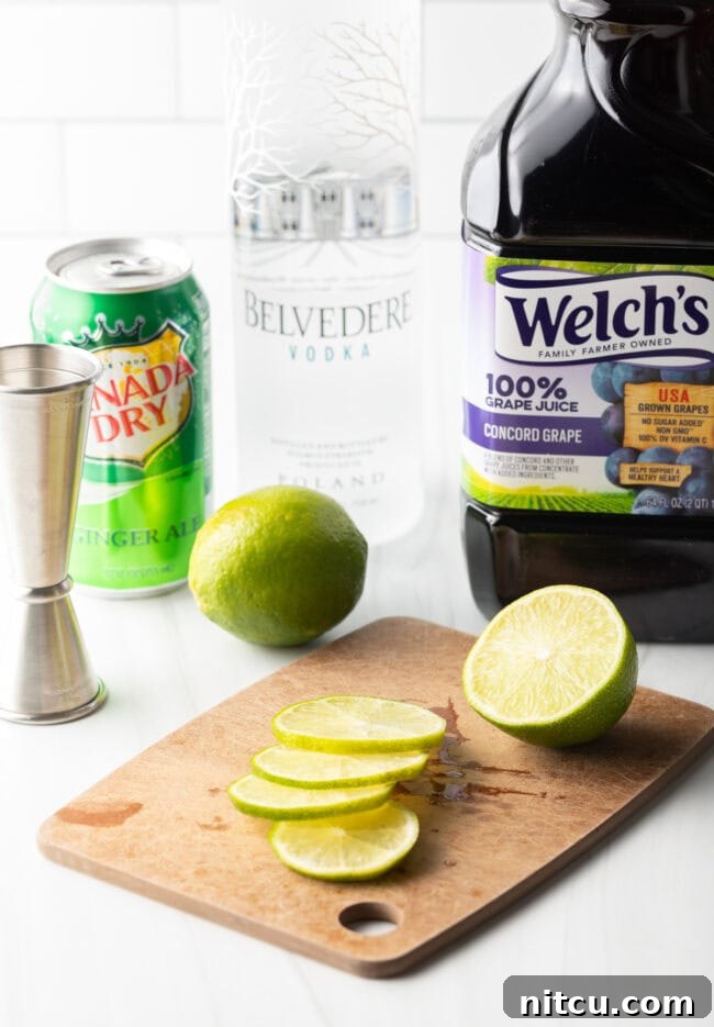Lifeforce Infusion 4 A freshly halved lime on a wooden cutting board, with one half already thinly sliced for garnish.