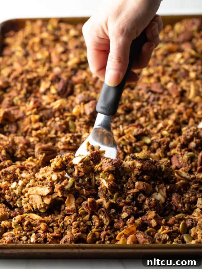 Ultimate Keto Granola 12 Close-up of golden, crunchy keto granola in a large bowl.