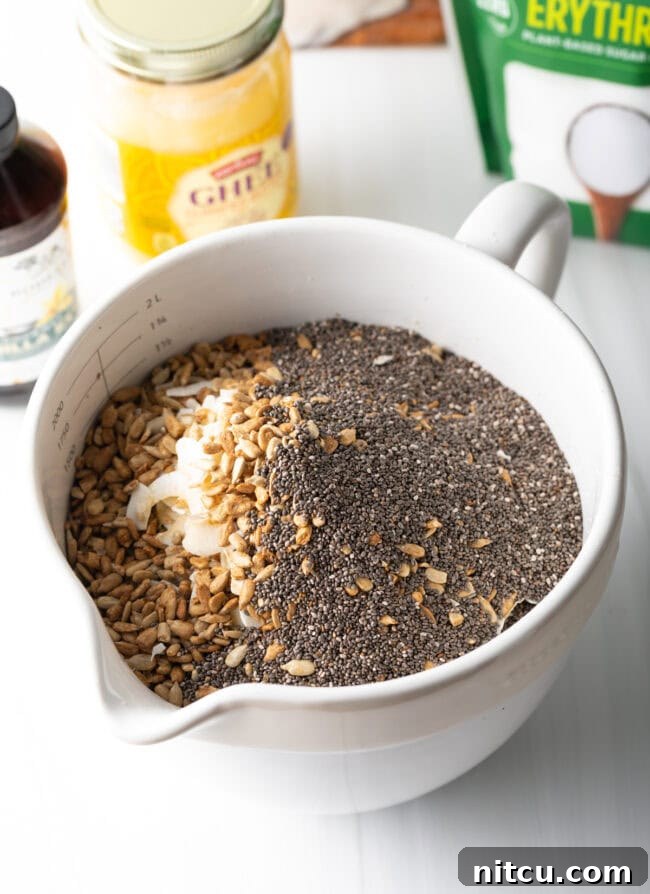 Ultimate Keto Granola 8 Mixing ghee and almond butter in a small bowl.