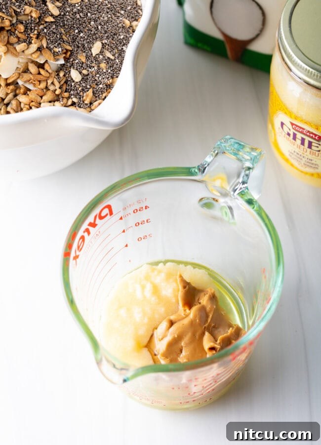 Ultimate Keto Granola 9 All wet ingredients mixed in a small bowl, ready to be combined with dry ingredients.