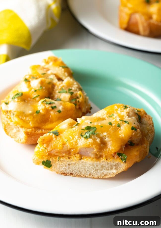 Cajun Shrimp Crostini 12 Two perfectly cooked pieces of shrimp toast recipe on a white plate, garnished with parsley, ready for a delightful bite.