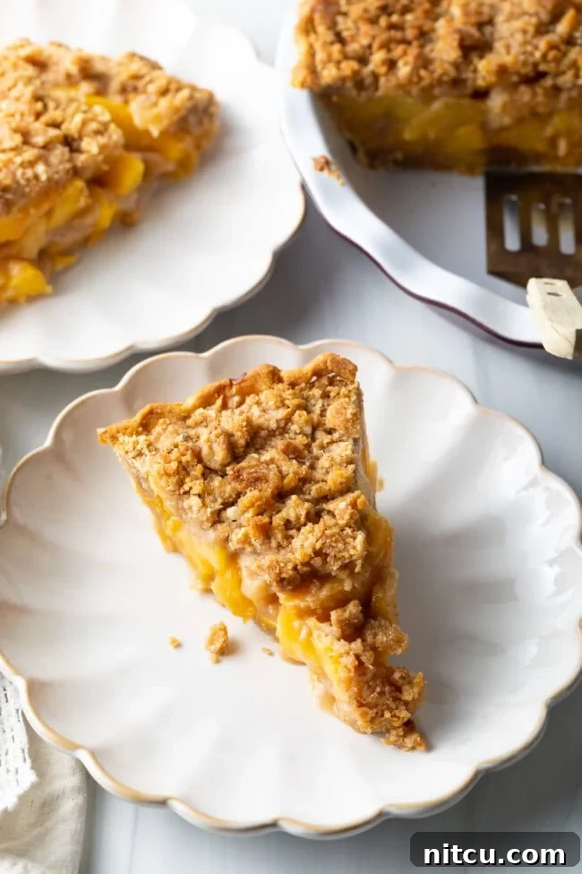 Anytime Peach Pie 14 A perfectly baked peach crumble pie, cooling on a wire rack.