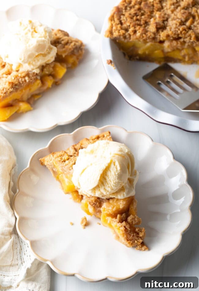 Anytime Peach Pie 17 Final top-down shot of a golden-brown peach crumble pie, ready to be served, perfect with fresh or frozen peaches.