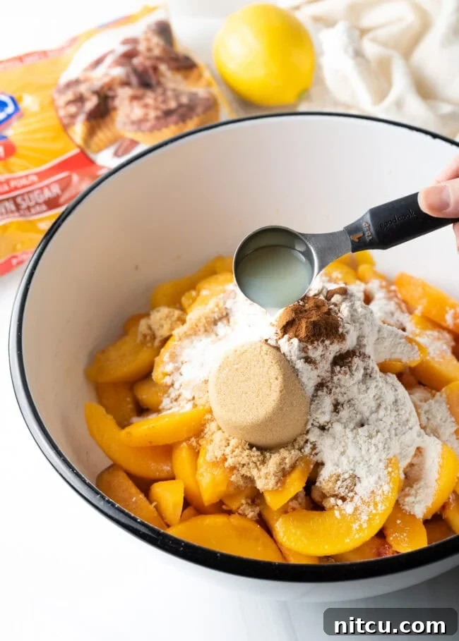 Anytime Peach Pie 7 Mixing peaches with sugar and spices for the pie filling.