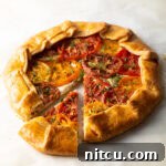 Rustic Italian Tomato Pie 12 Italian Tomato Pie, a savory galette with flaky crust, goat cheese, and heirloom tomatoes
