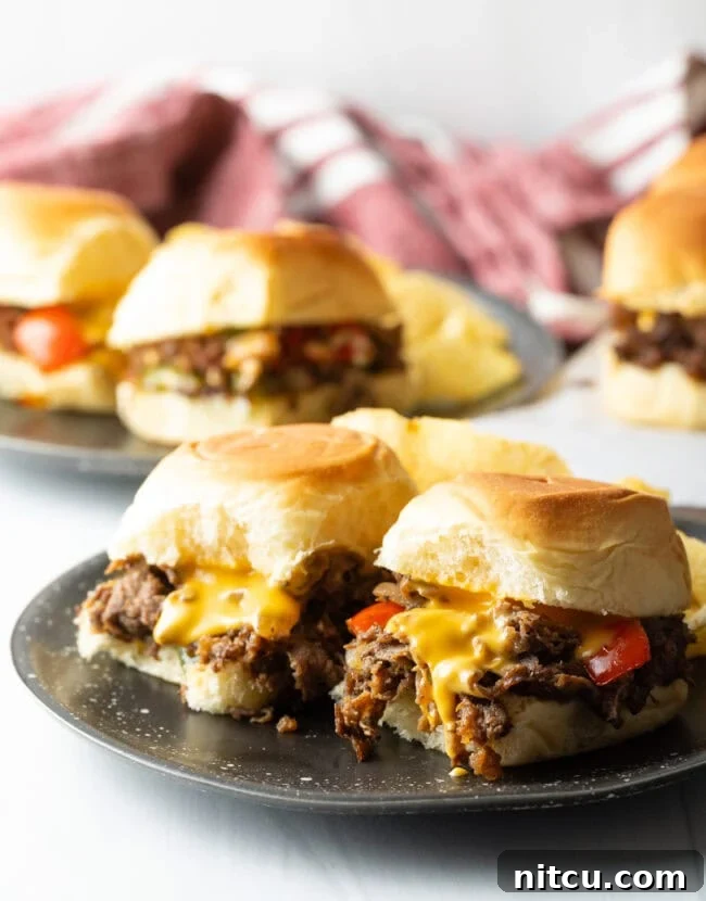 Philly Cheesesteak Bites 2 Plate of two philly cheesesteak sliders - Shaved Beef Steak Recipe