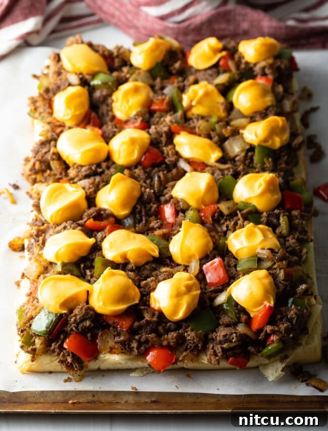 Philly Cheesesteak Bites 11 Topped with dollops of Cheez Whiz.