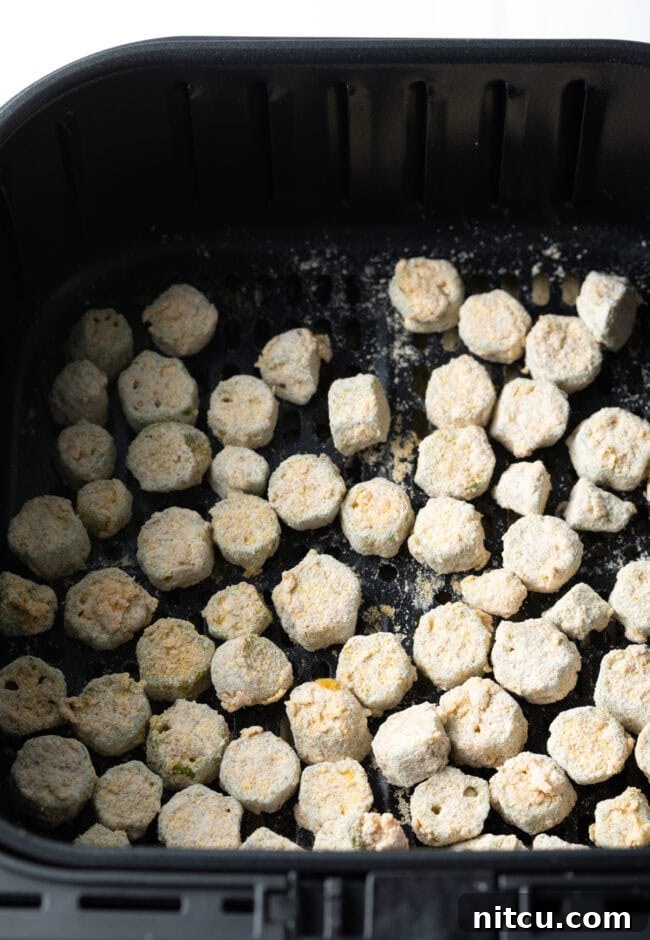 Crispy Air Fryer Okra Fries 10 Battered pieces in the basket.