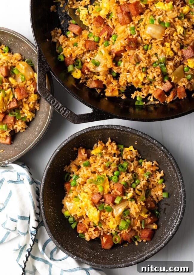 Tropical Kimchi Fried Rice 3 Top down view bowl of hawaiian fried rice with skillet.